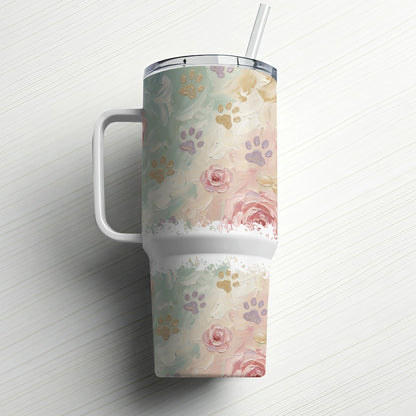 White tumbler with floral and paw print pattern, with handle and straw.