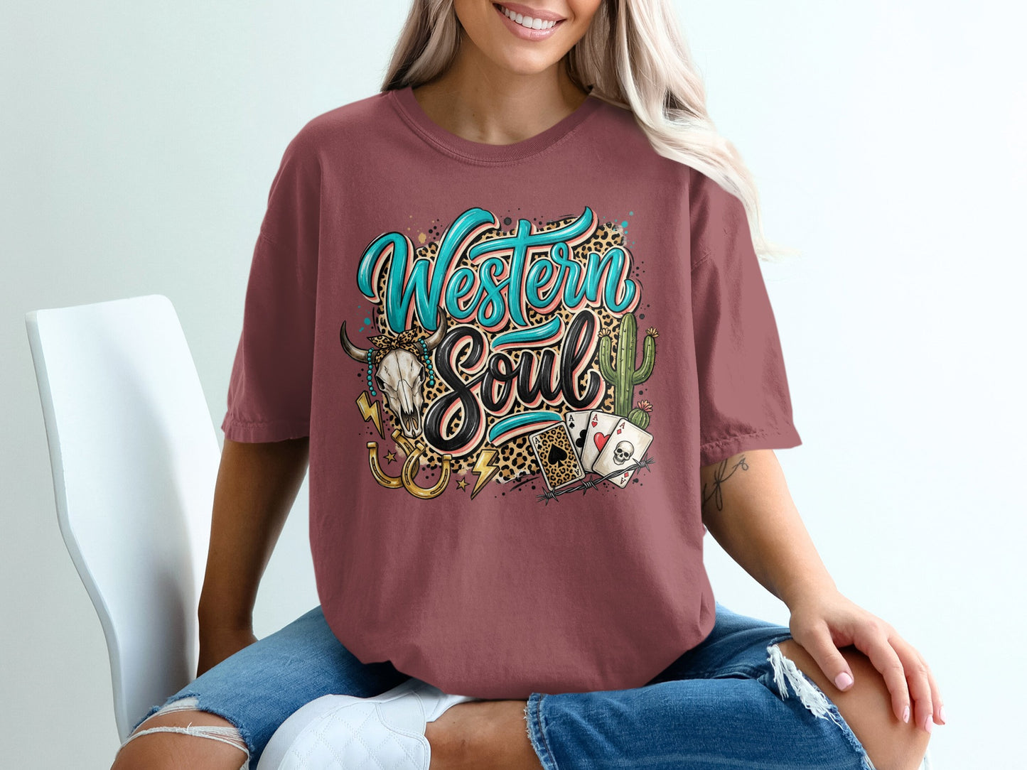 T-shirt with "Western Soul" text, skull, cactus, horseshoe, and playing cards.