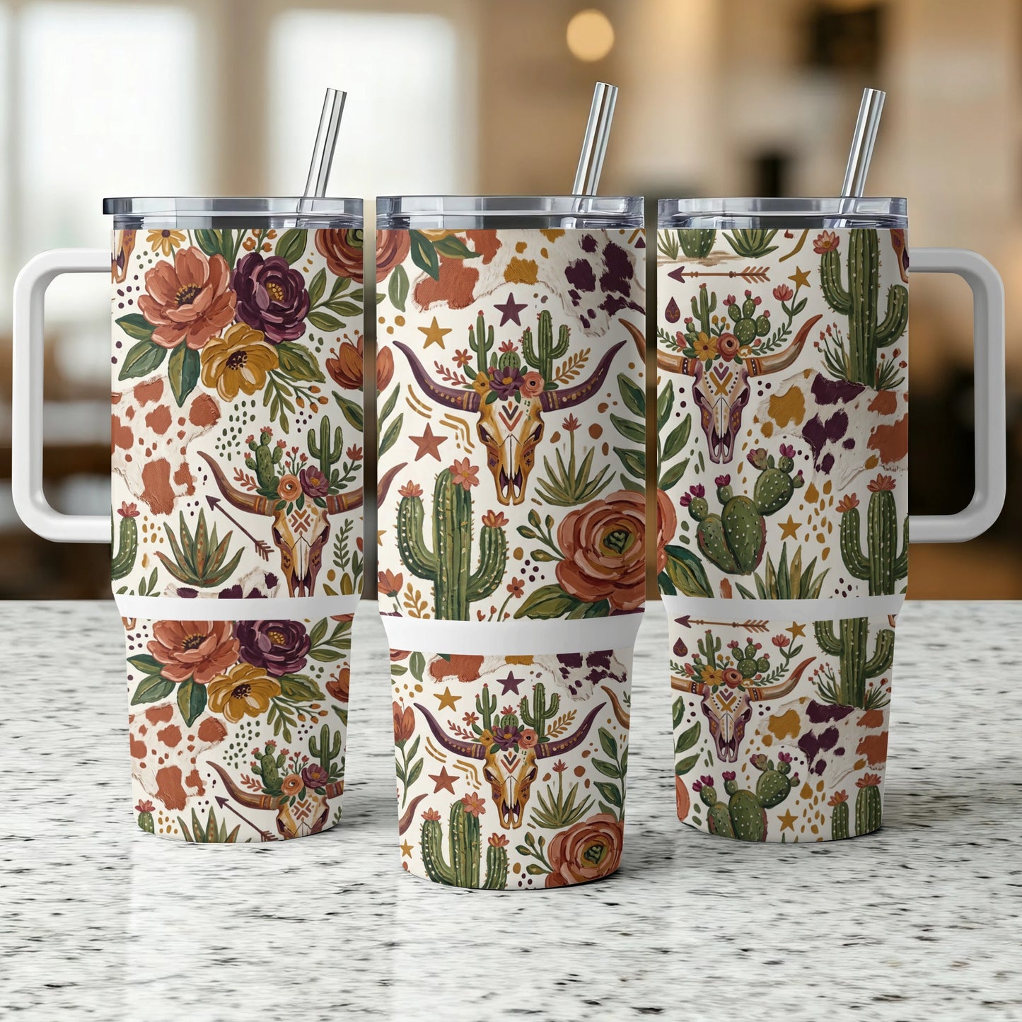 Three tumblers with floral, cactus, and cow skull patterned designs.