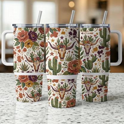 Three tumblers with floral, cactus, and cow skull patterned designs.