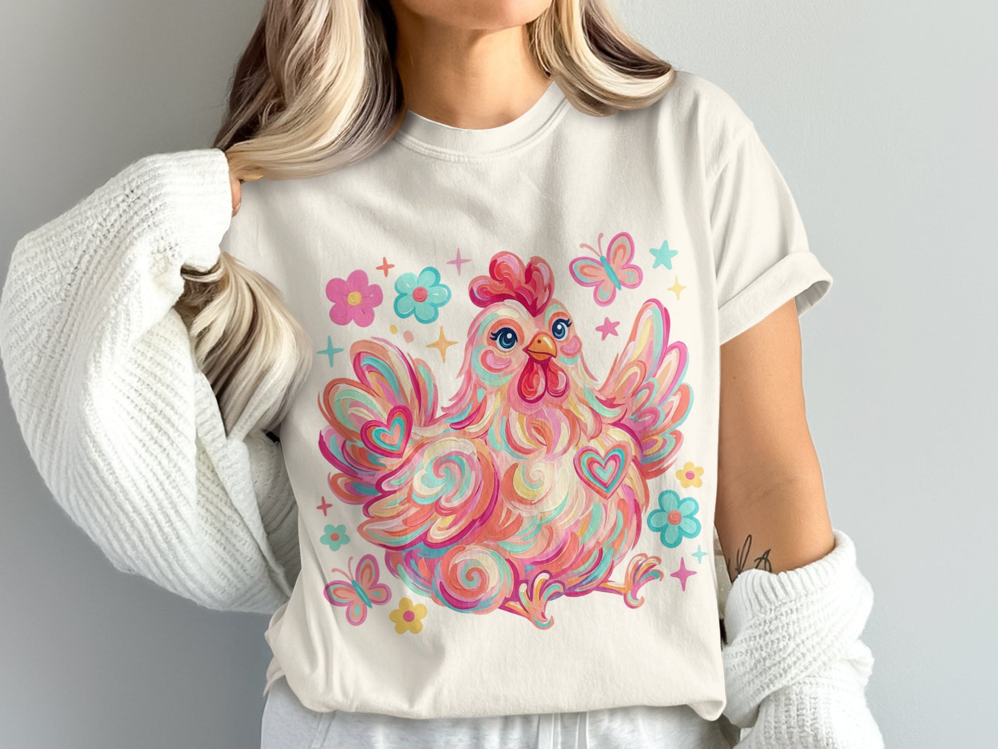 Colorful abstract chicken with butterflies and flowers on a cream t-shirt.