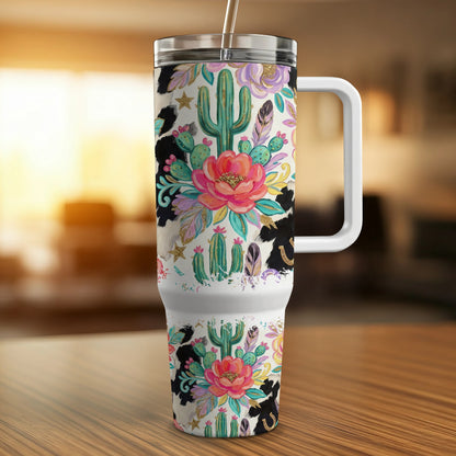 Tumbler with cactus, floral, and cow print design.
