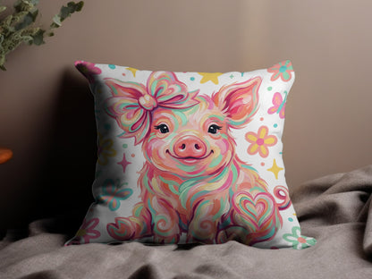 Pink pig with colorful swirls and bow on a floral patterned pillow.