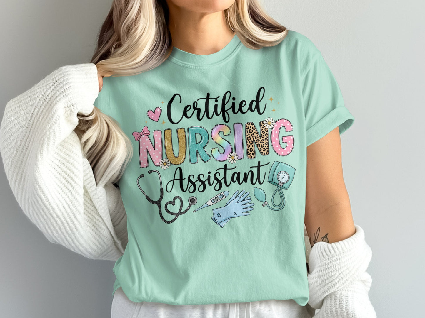 "Certified Nursing Assistant" text with medical icons on a light green t-shirt.