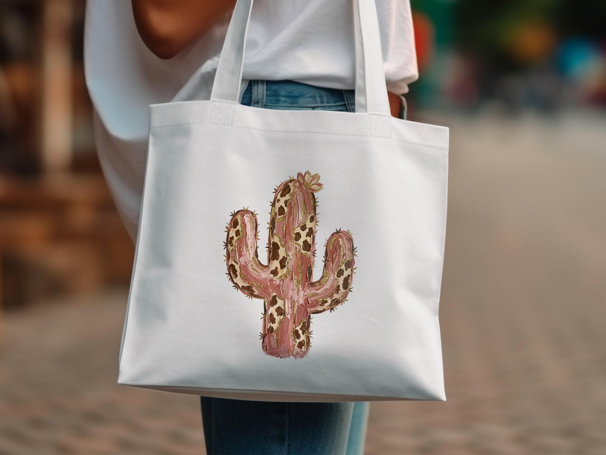 White canvas tote bag with a watercolor painted cactus design.