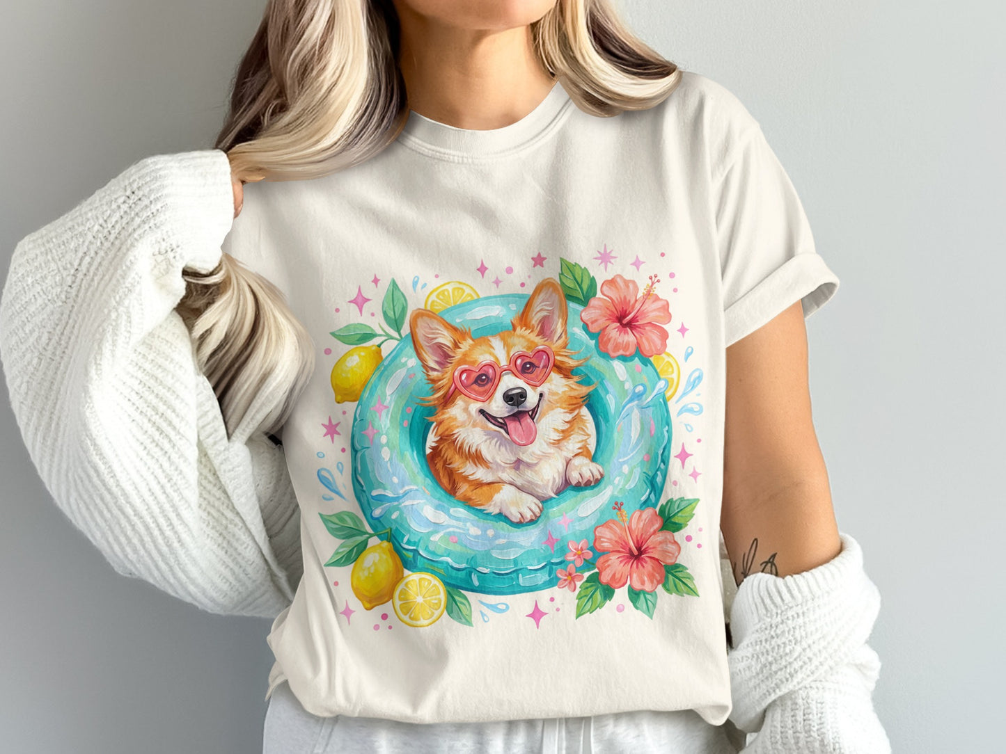 Corgi wearing heart sunglasses in inflatable ring with lemons and flowers.