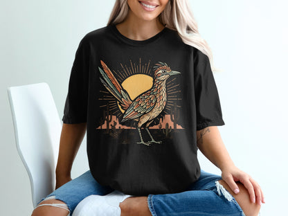 Black t-shirt featuring a roadrunner in a desert landscape with a stylized sun.