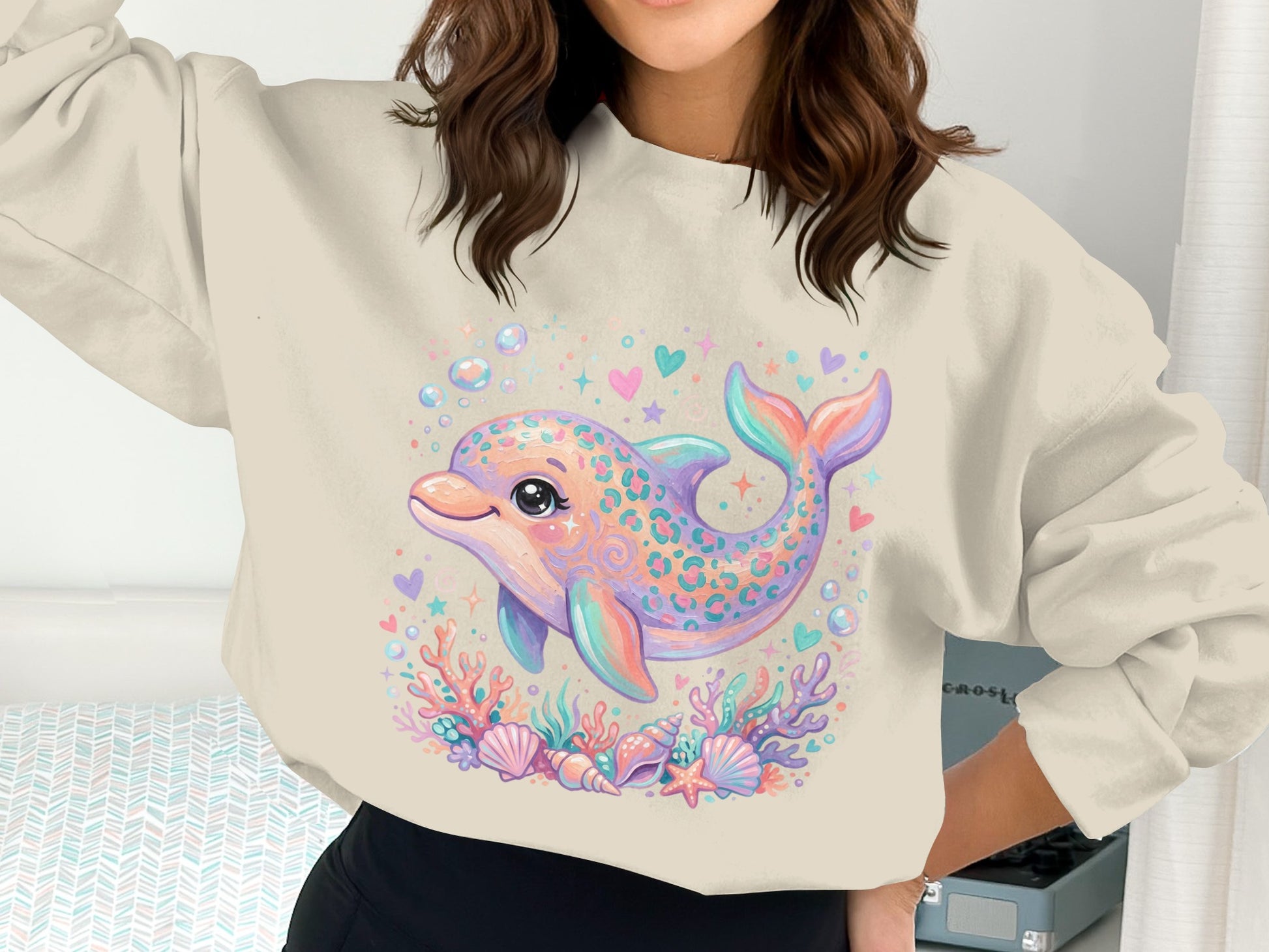 Sweatshirt with a colorful cartoon dolphin and ocean motifs.