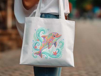 White tote bag with colorful floral dolphin, starfish, and bubbles design.