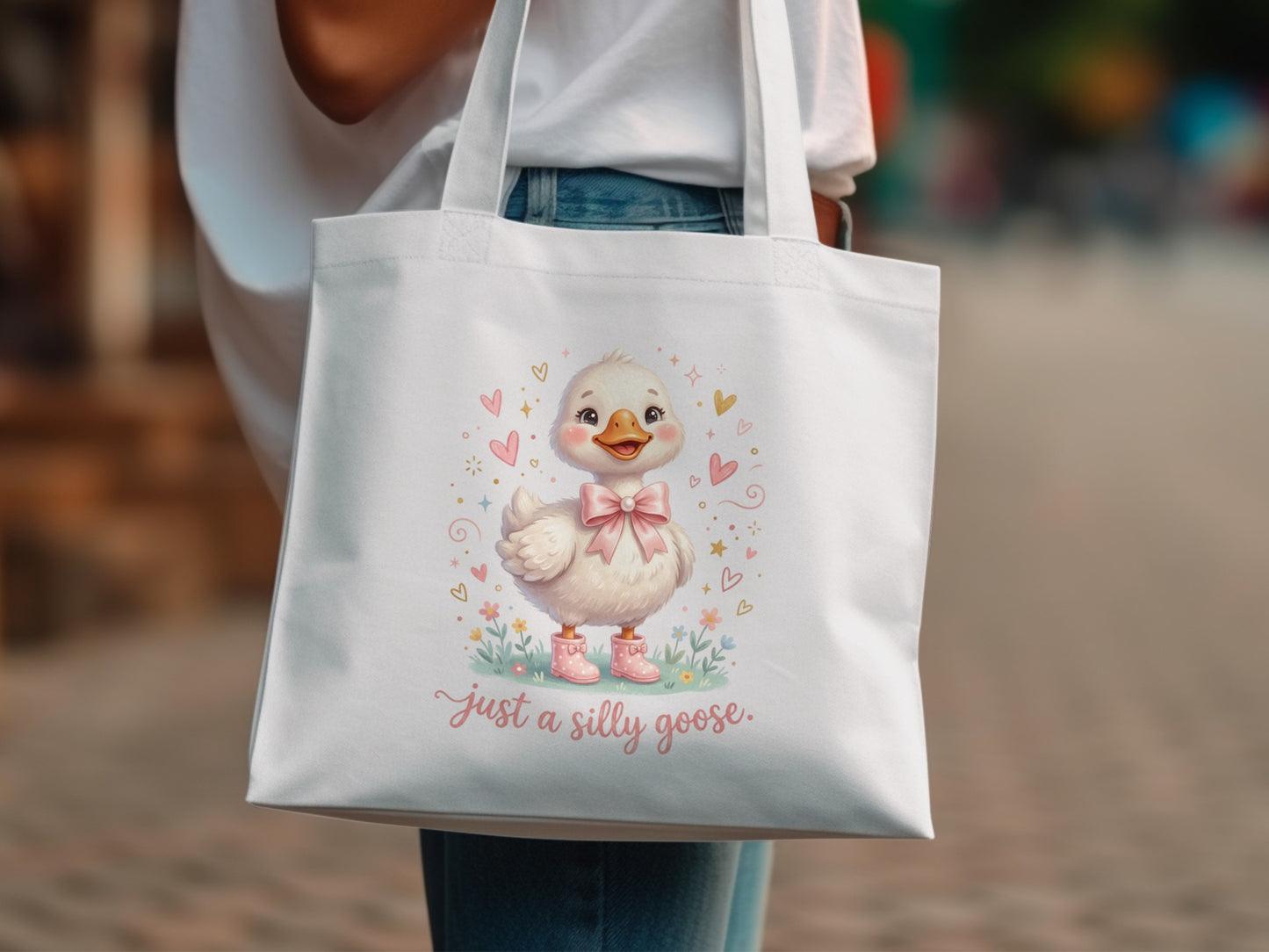 Cute cartoon duck wearing pink boots and a bow, with text "Just a silly goose."