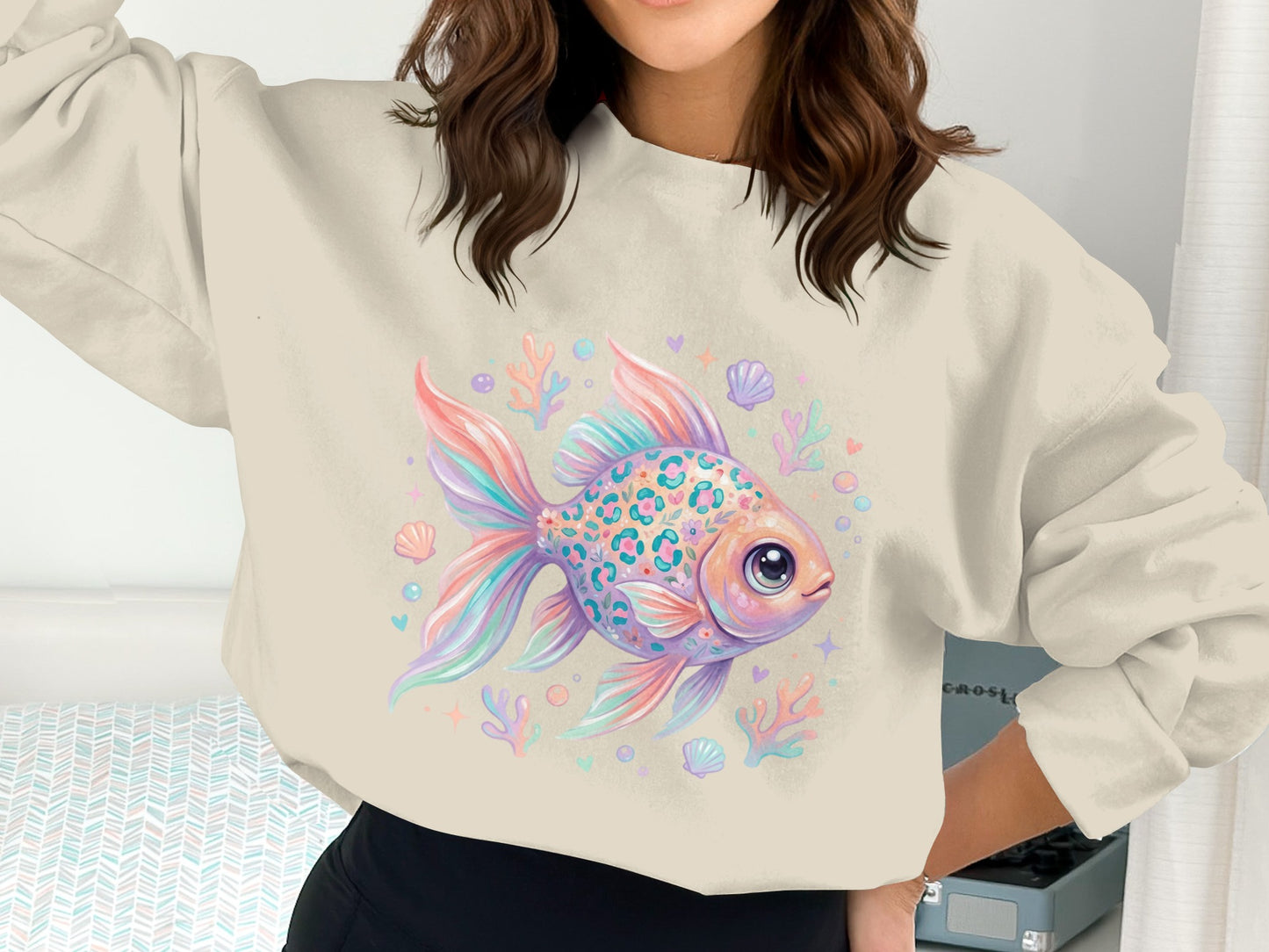 Crewneck sweatshirt with colorful leopard-print goldfish and ocean-themed graphics.