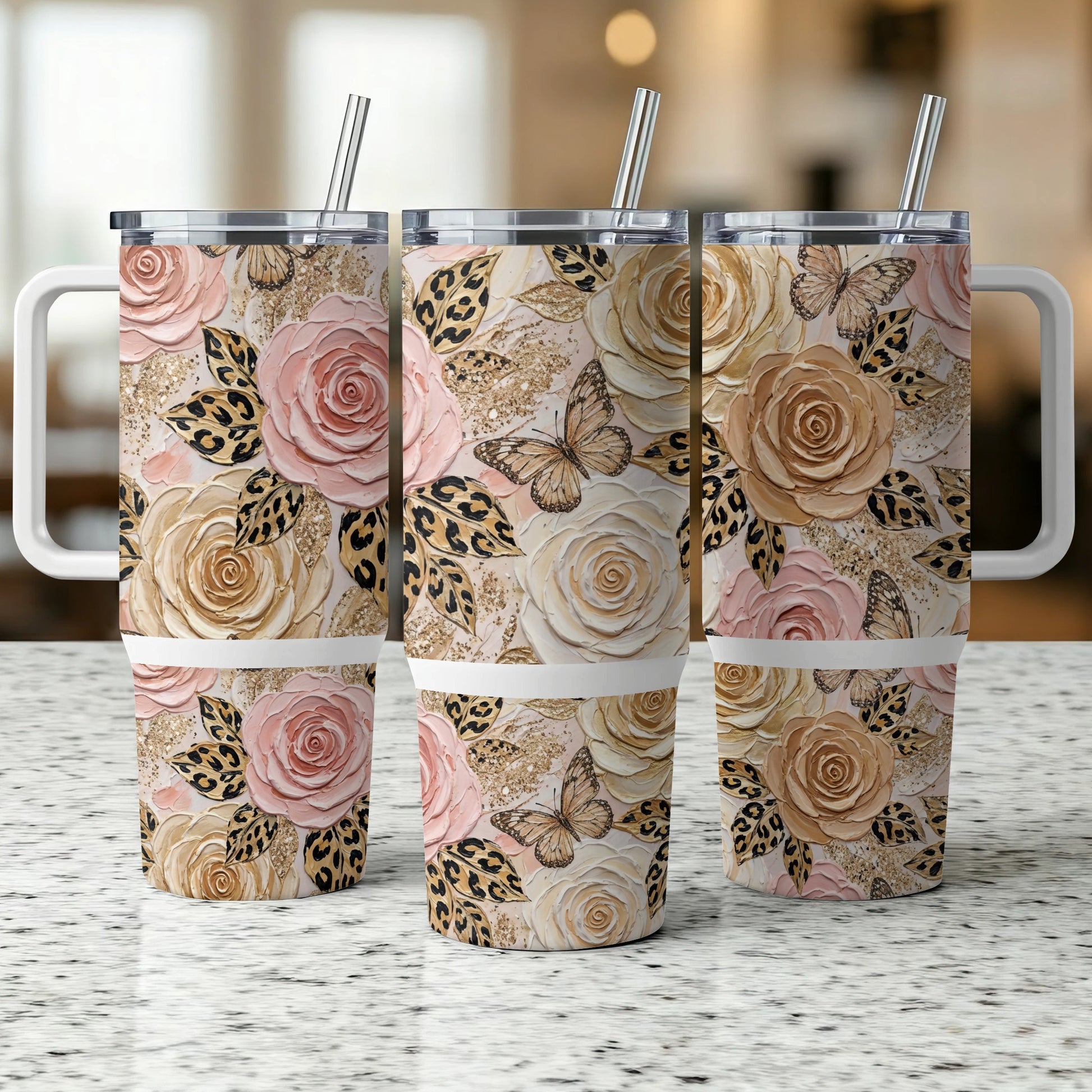 Three tumblers with roses, butterflies, and leopard print.