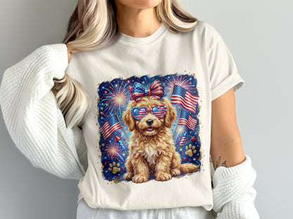 Golden doodle puppy wearing patriotic sunglasses and bow, with fireworks.