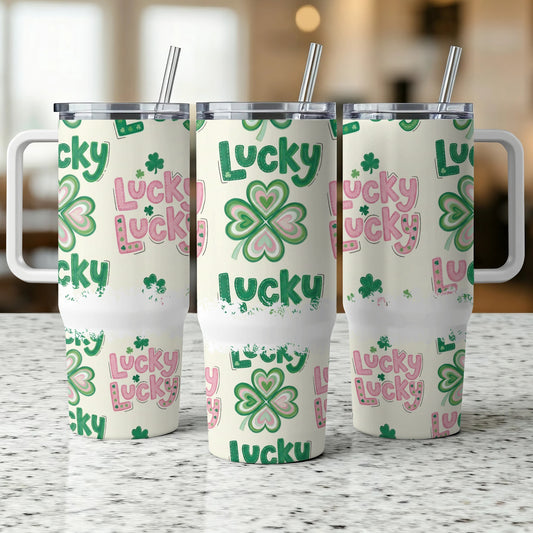 Three tumblers with a repeating "Lucky" and shamrock pattern.