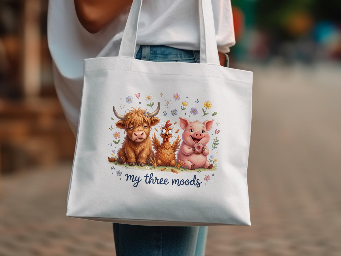 Tote bag with cow, chicken, and pig characters wearing donuts and flowers.