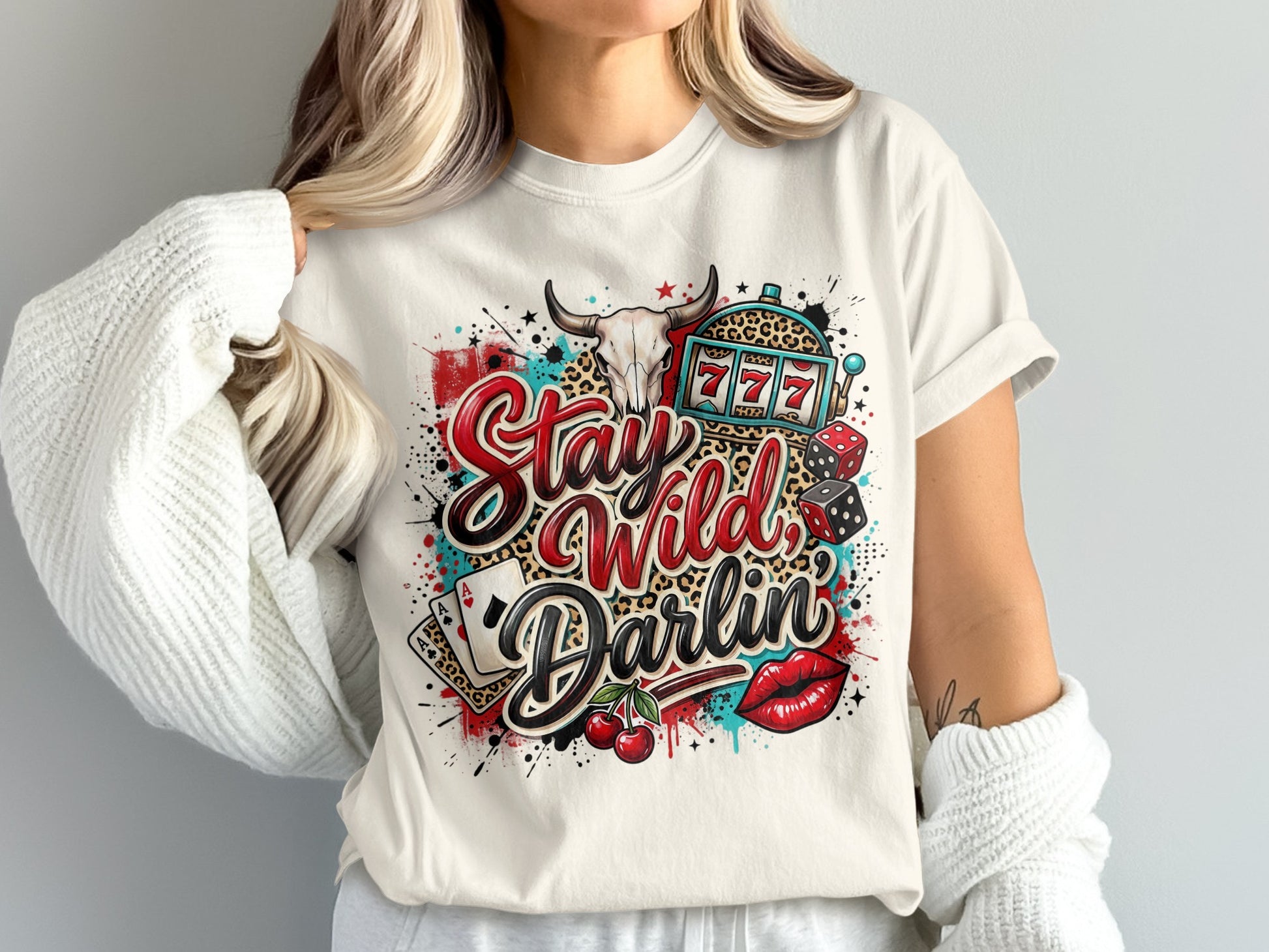 White t-shirt with "Stay Wild Darlin'" text, slot machine, dice, cherries, and leopard print.