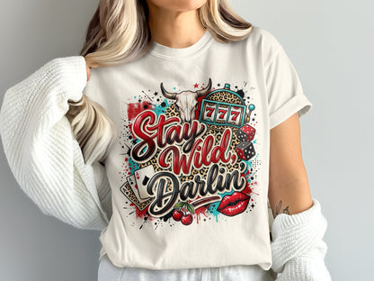 White t-shirt with "Stay Wild Darlin'" text, slot machine, dice, cherries, and leopard print.