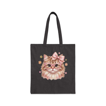 Tote bag with pink bow, glasses, and flowers on a cat's face.
