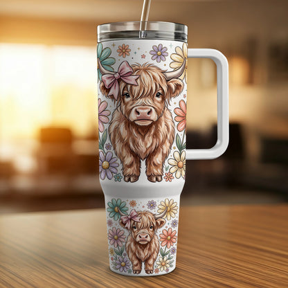 Highland cow with bow and flowers on a tumbler.