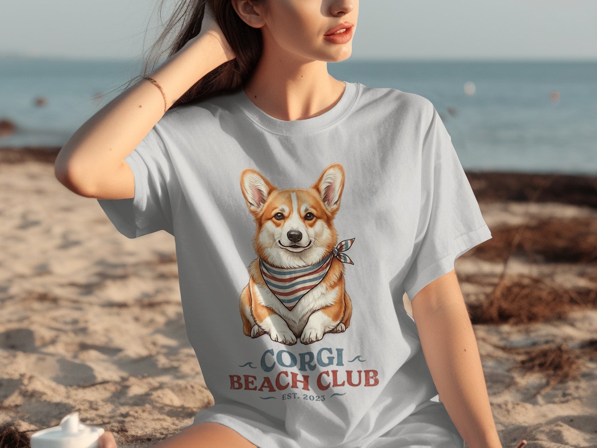 White t-shirt with a smiling corgi wearing a bandana, "Corgi Beach Club" text.