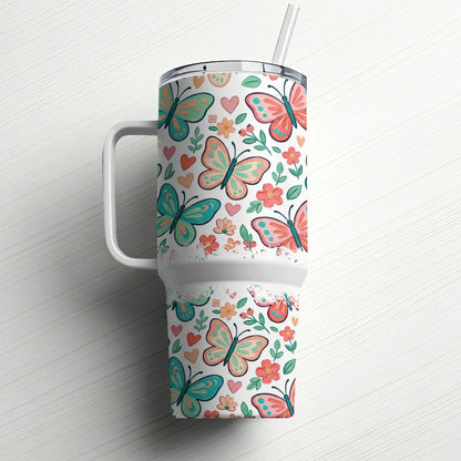 Tumbler with pink and teal butterflies, hearts, and floral pattern.