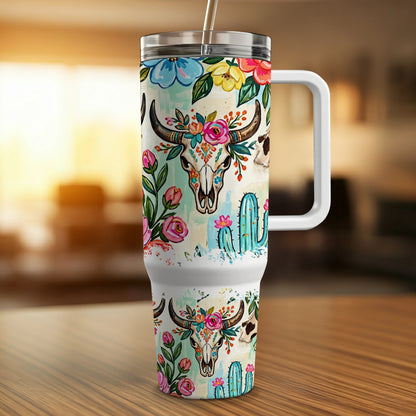 Skull with floral crown and cacti design on a white travel tumbler.