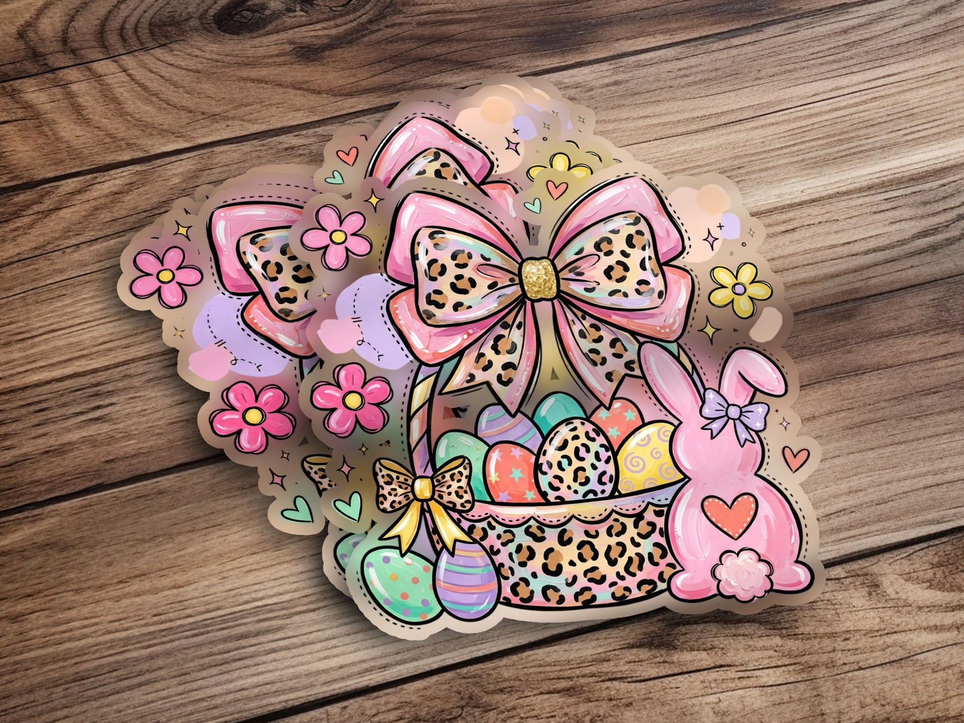Easter basket with eggs, bunny ears, and bows on a wooden background.