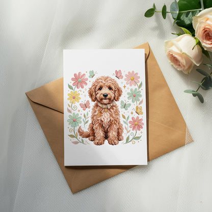 Card with a golden doodle dog surrounded by flowers and butterflies.