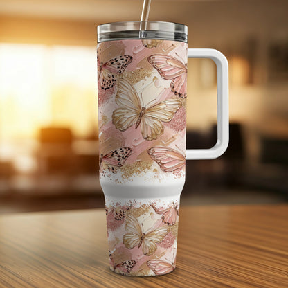 White tumbler with butterfly and abstract paint splatter design.