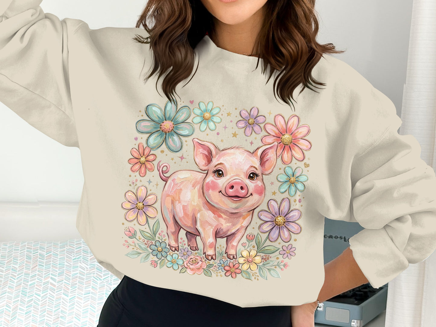 Cute pig illustration surrounded by colorful flowers on a cream sweatshirt.