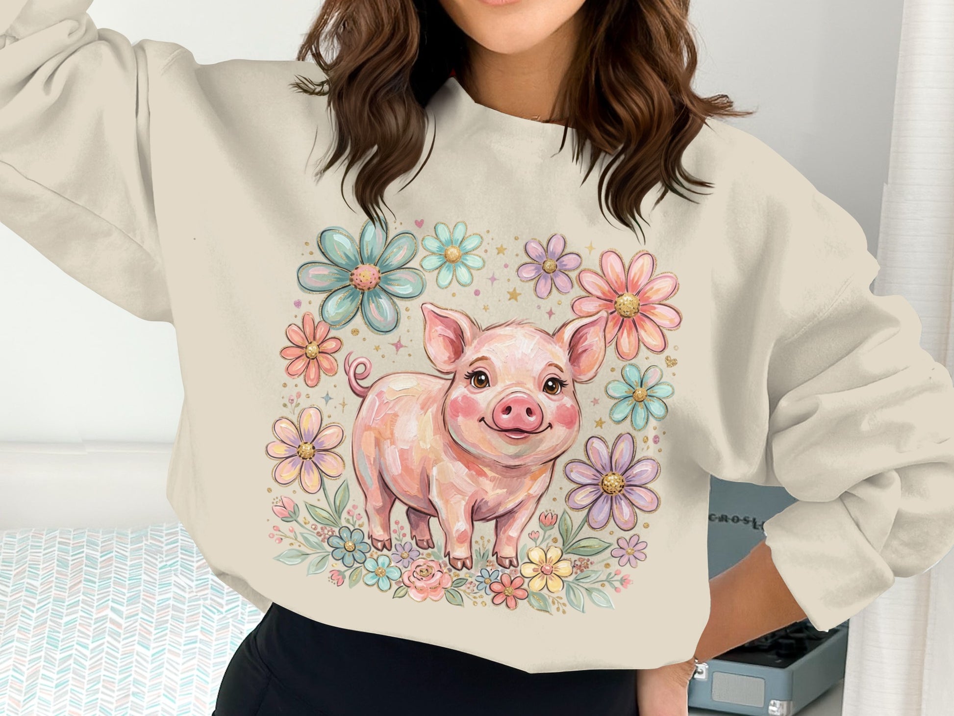 Cute pig illustration surrounded by colorful flowers on a cream sweatshirt.