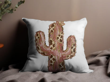 Watercolor saguaro cactus with gold accents on a decorative throw pillow.