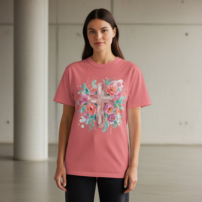 Pink t-shirt with a floral cross graphic.