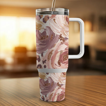 Floral and leopard print tumbler with straw and handle.