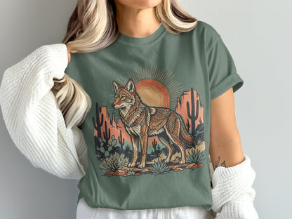 T-shirt featuring a coyote graphic with desert landscape and sun.