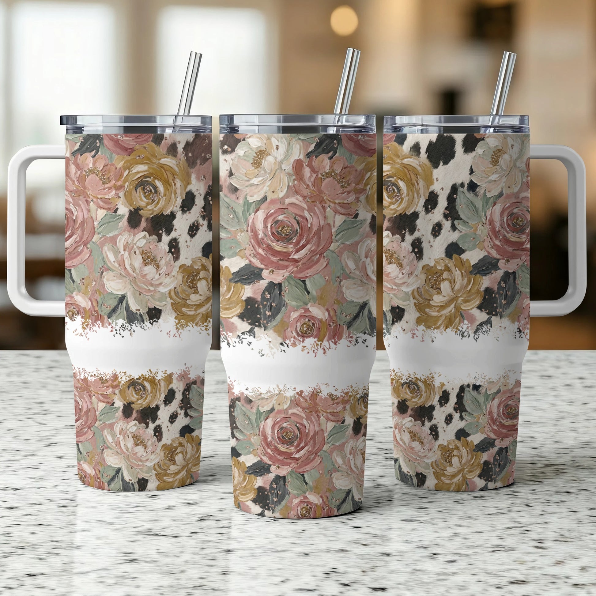 Three tumblers with floral and cow print patterns, shown side-by-side.