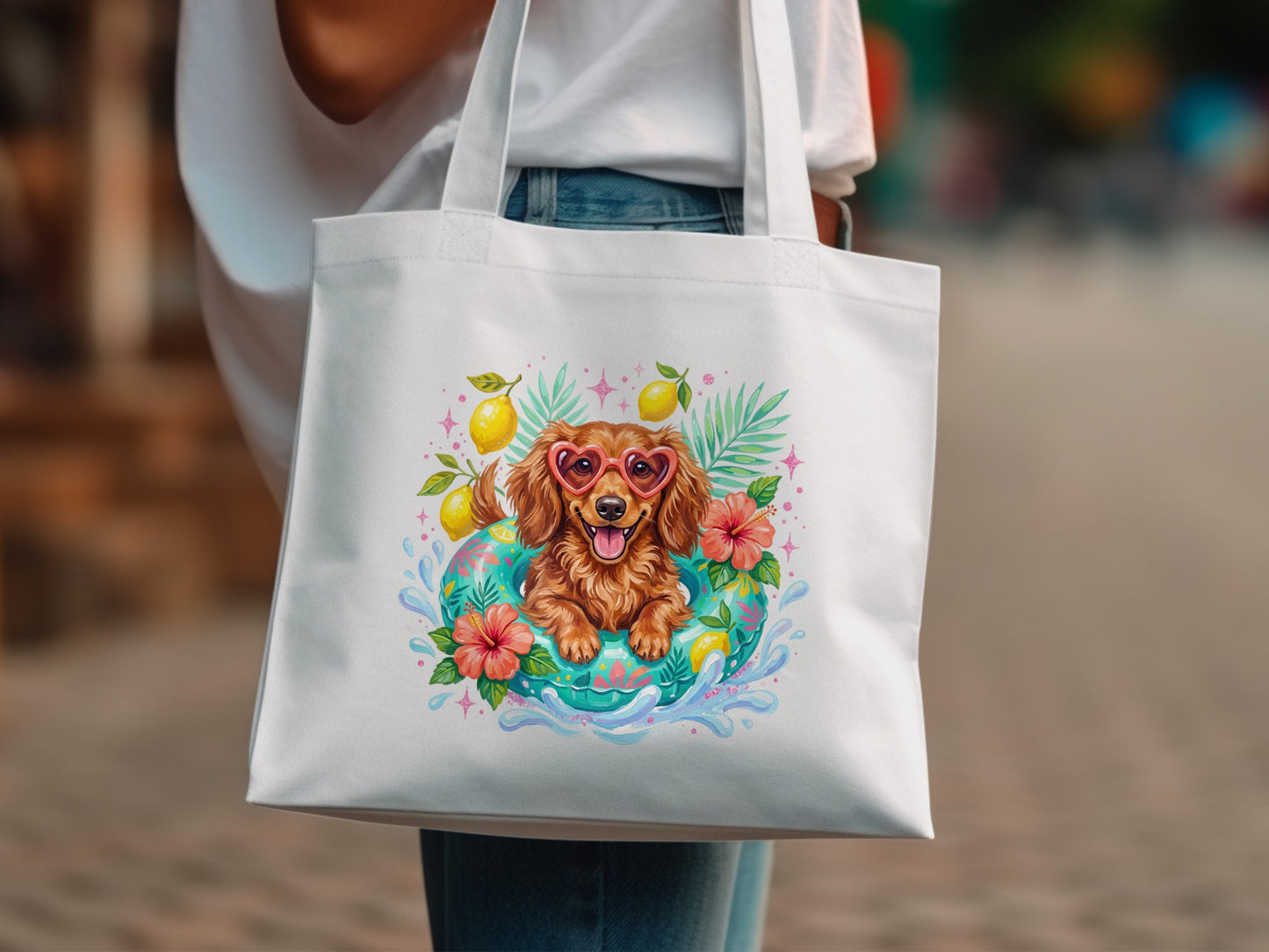Tote bag with Dachshund wearing heart sunglasses in a float surrounded by lemons and flowers.