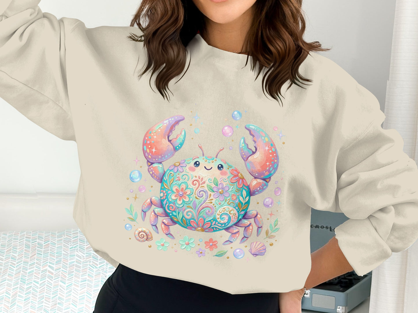 Colorful crab graphic on a cream crewneck sweatshirt.
