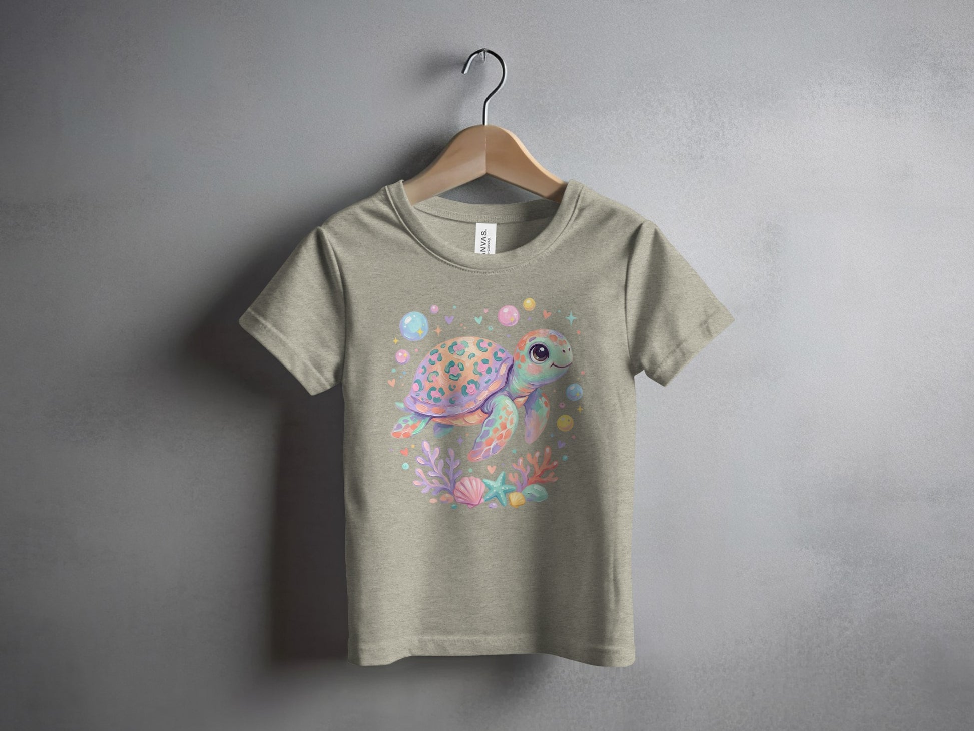 T-shirt featuring a whimsical watercolor sea turtle with coral and bubbles.