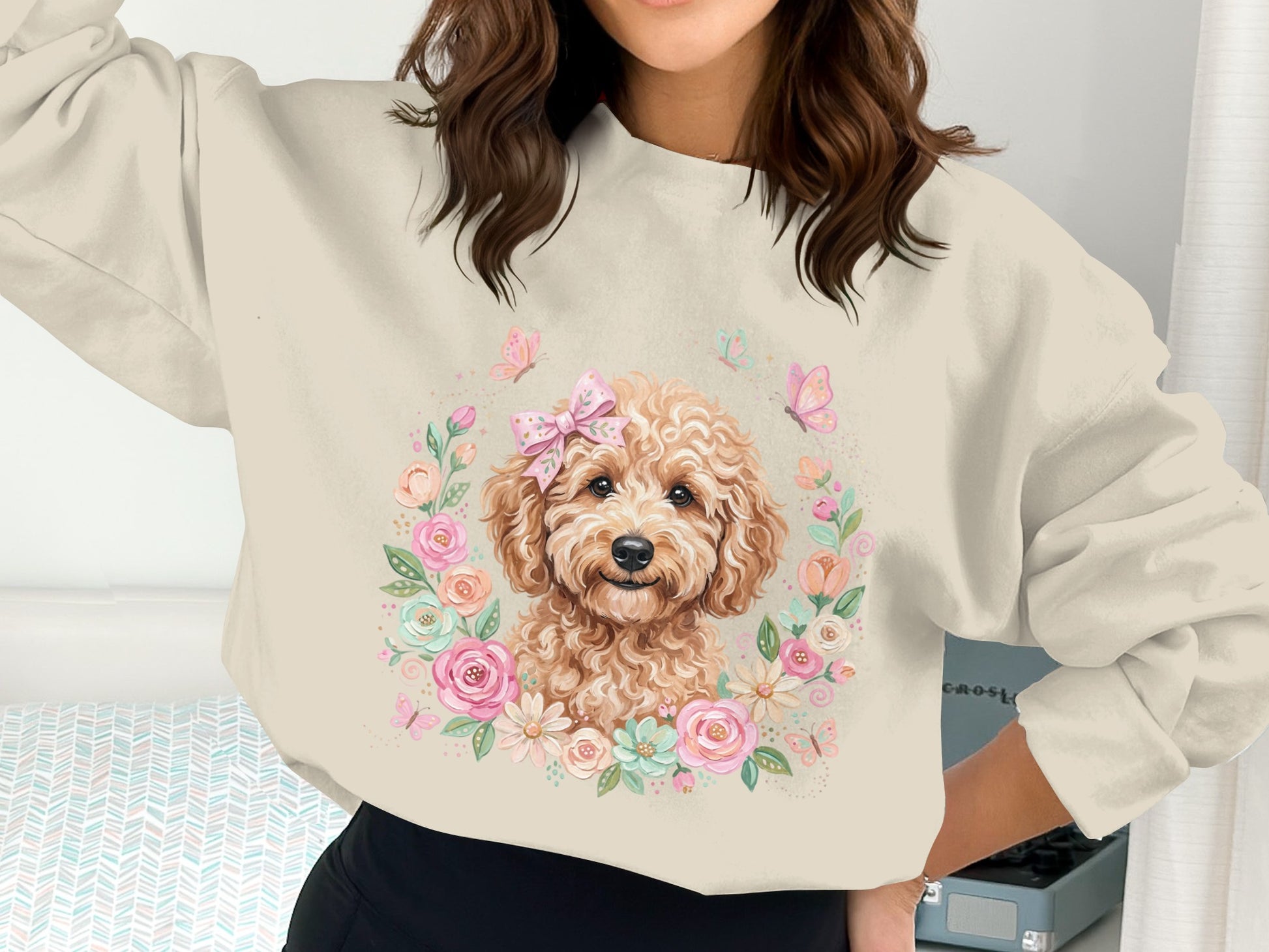 Crewneck sweatshirt with a cream background featuring a dog illustration surrounded by flowers.