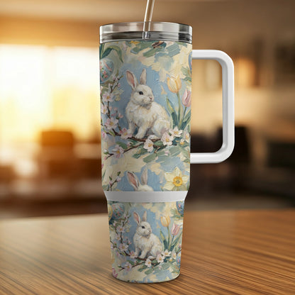 White bunny on floral background with tulips on a travel tumbler.