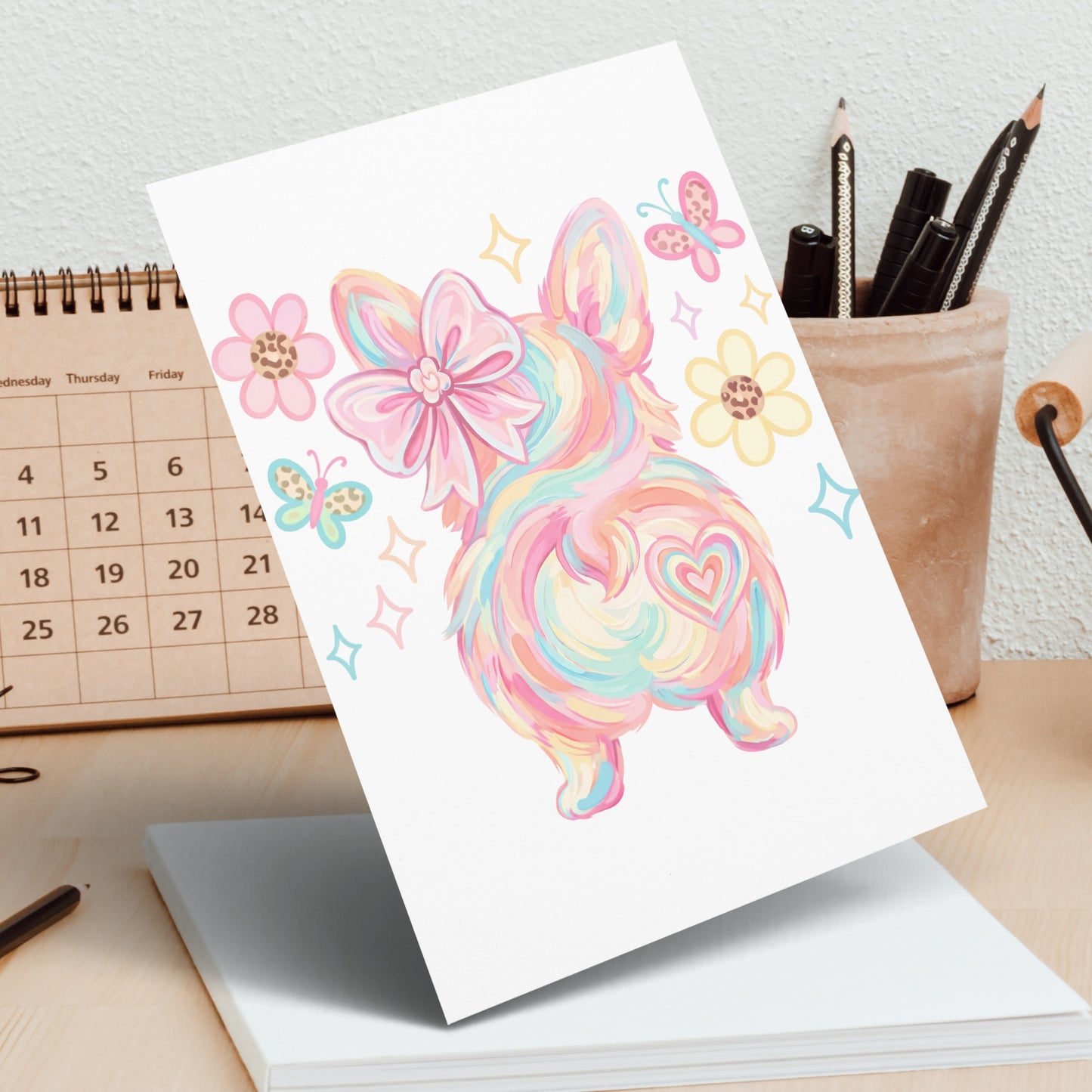 Rainbow corgi with colorful flowers and butterflies on card.