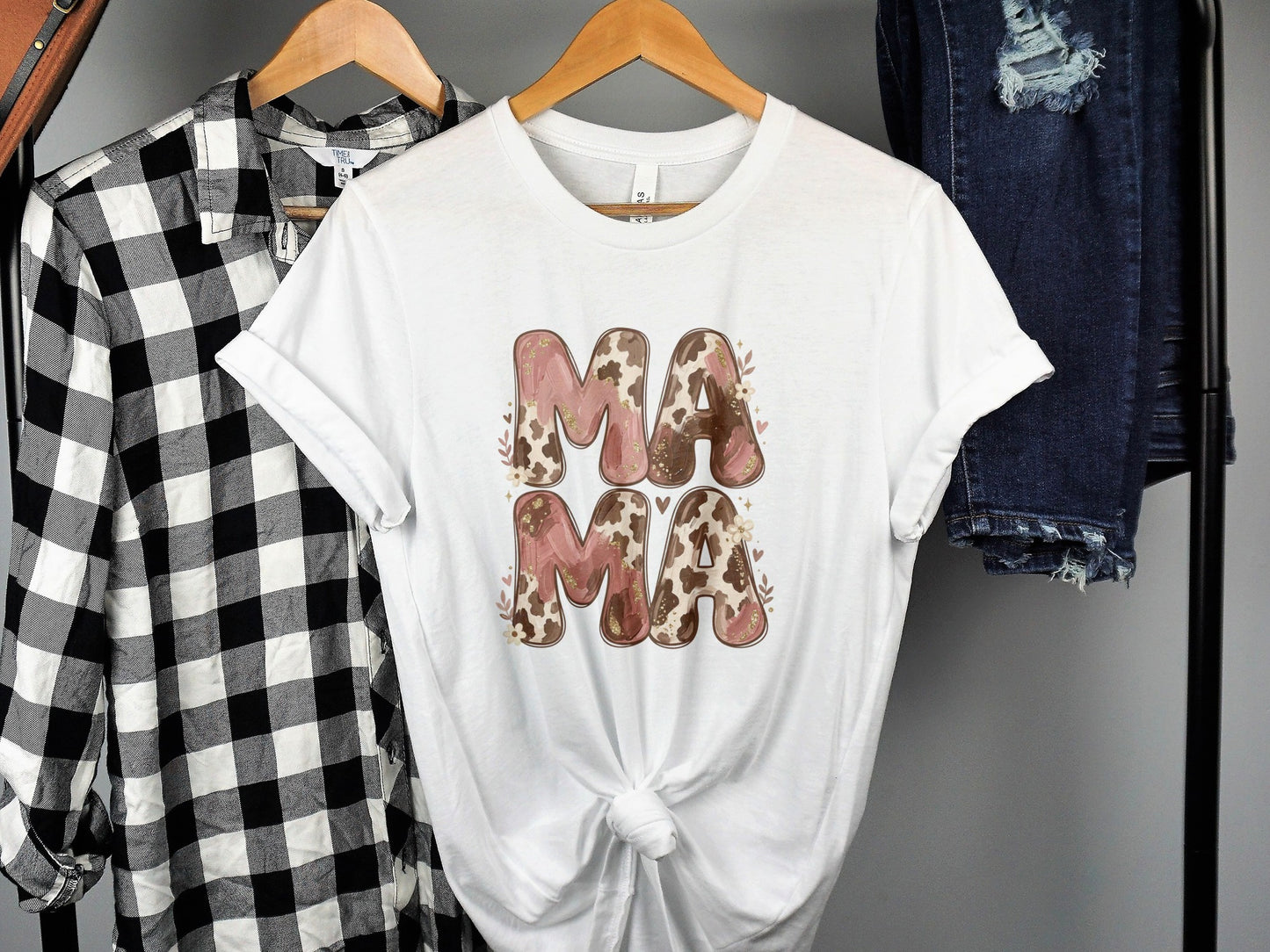 White t-shirt with "Mama" in a floral and cow print design.