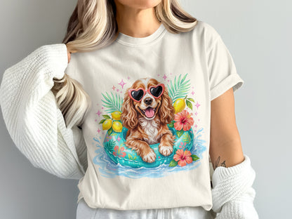 Dog in heart sunglasses floats in pool on inner tube with lemons and flowers.