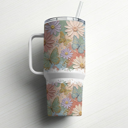 Pastel floral and butterfly design on a white insulated tumbler with straw.