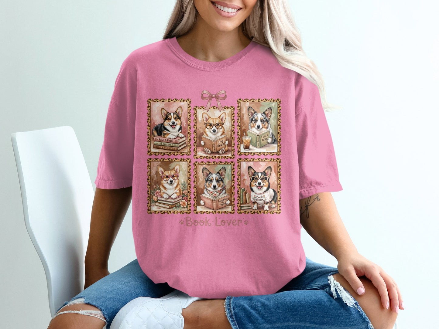 Pink t-shirt featuring six framed illustrations of corgis reading books.