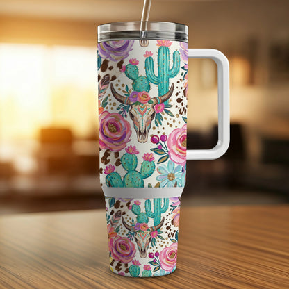 Floral cactus and steer skull pattern on a white insulated tumbler with handle.