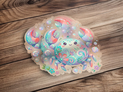 Cute cartoon crab sticker with floral and shell embellishments on wood.