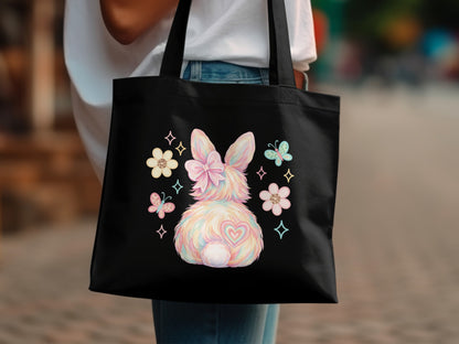 Black tote bag with pastel bunny tail and butterfly design.