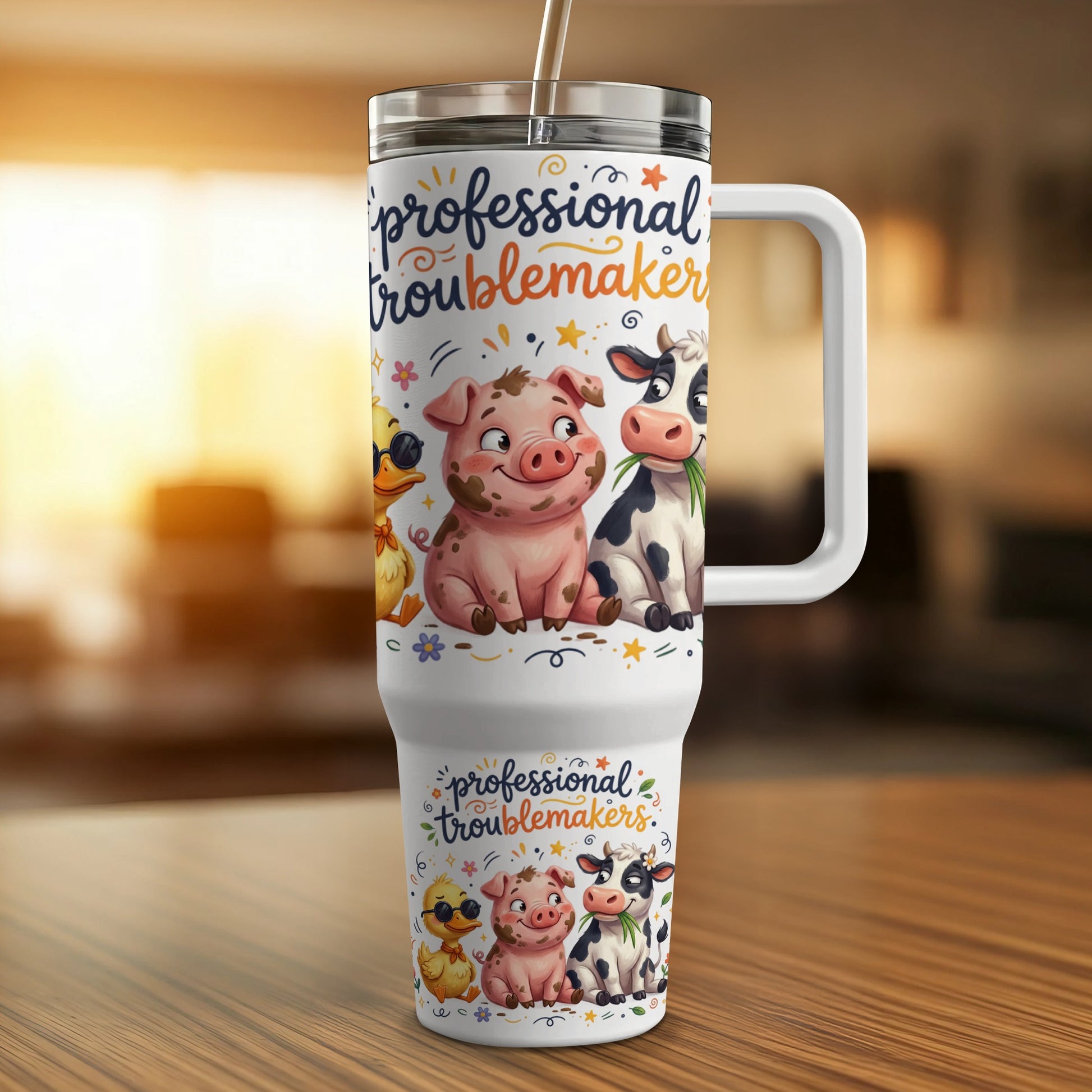Tumbler with "professional troublemakers" text and cartoon farm animals.
